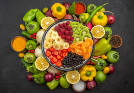 top view delicious fruit salad inside plate with fresh fruits dark tropical fruit tree exotic ripe diet photo Ethos Mart